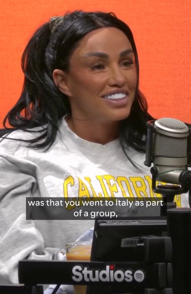 a woman wearing a california sweatshirt talks into a microphone