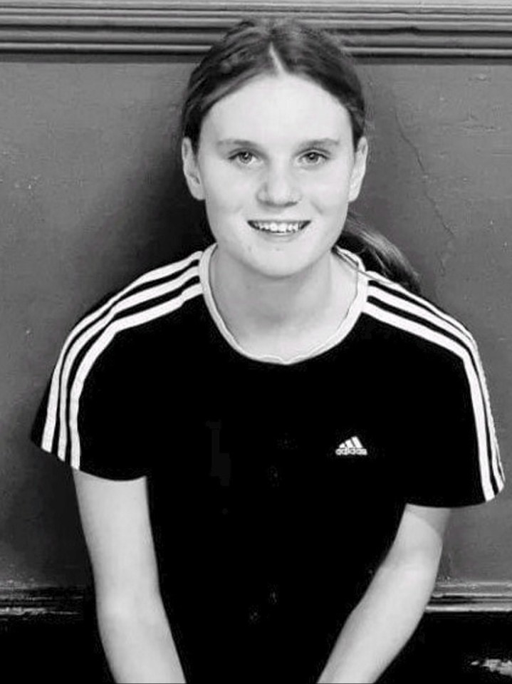 a black and white photo of a girl wearing an adidas shirt