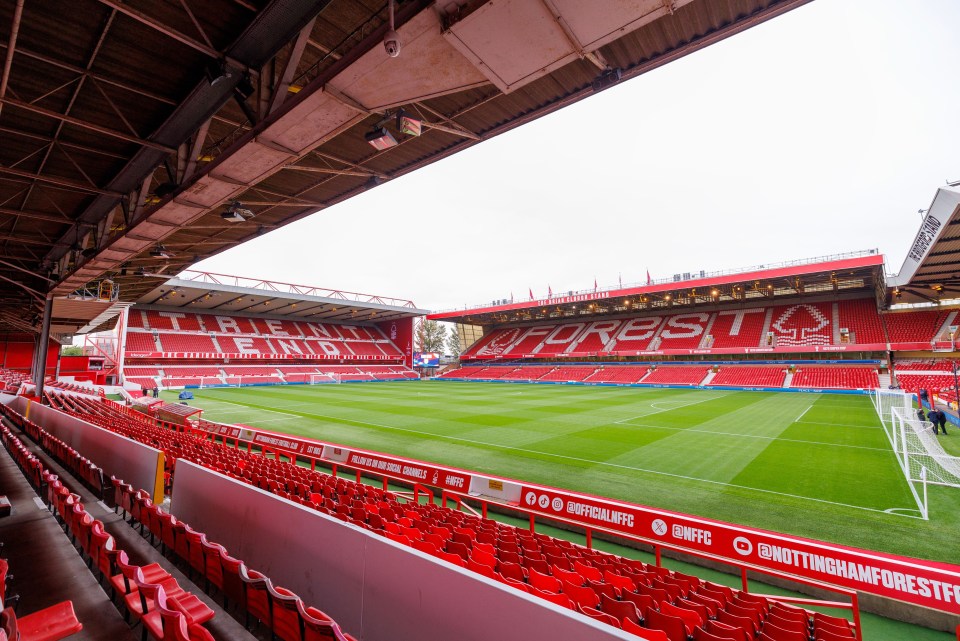 an empty soccer stadium with the word forest on the side