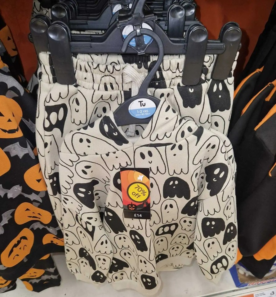 a pair of shorts with ghosts and pumpkins on them