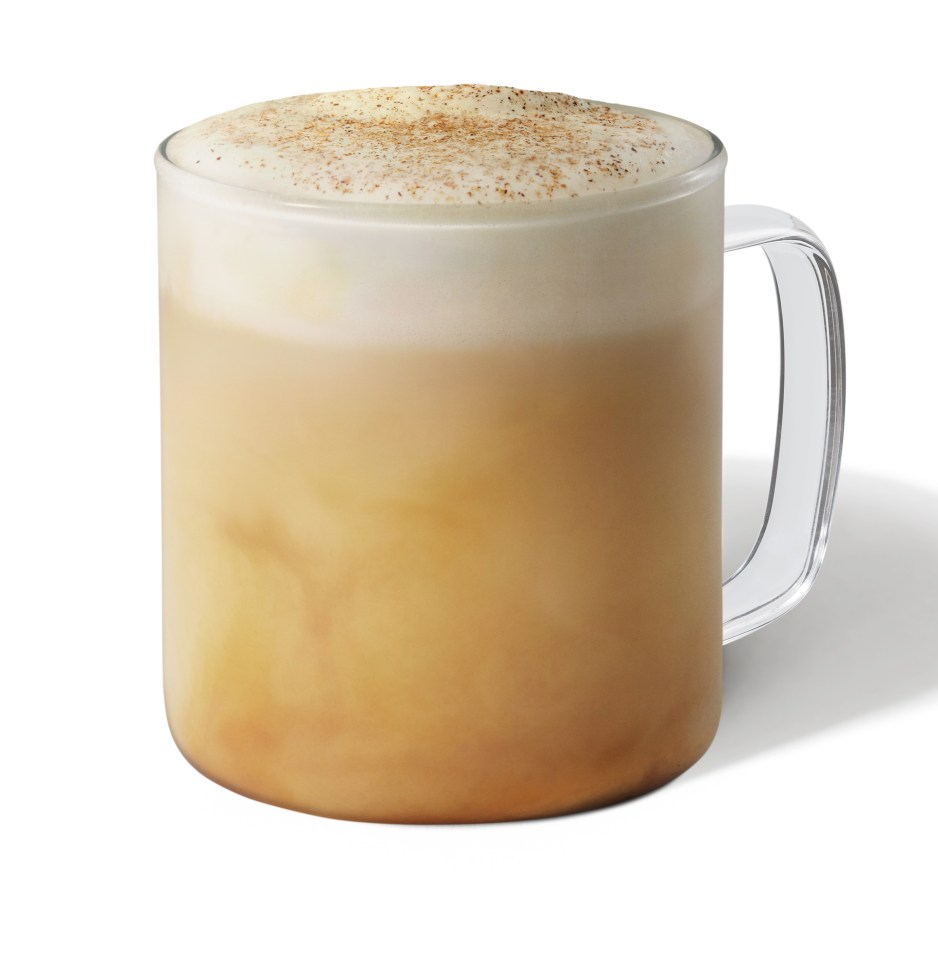 a cup of coffee with foam on top of it