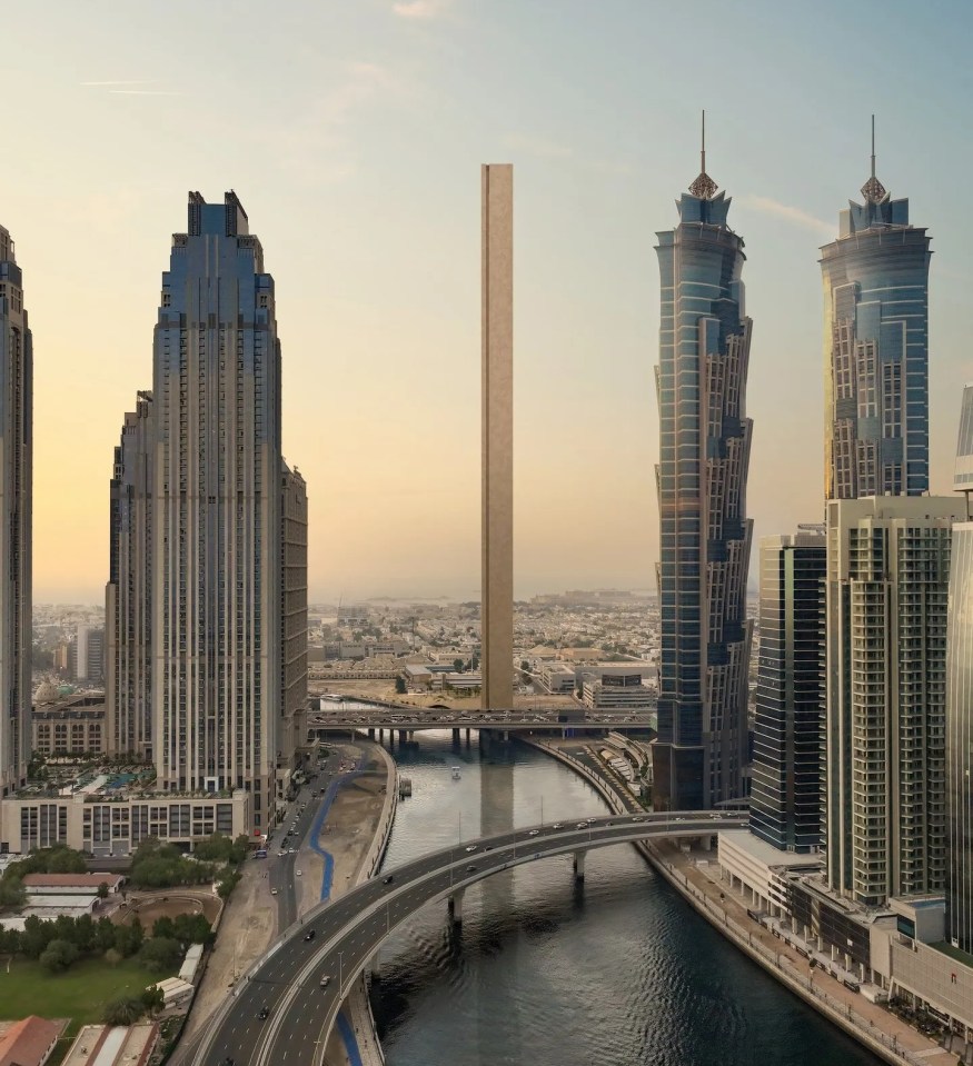 a bridge over a body of water surrounded by tall buildings