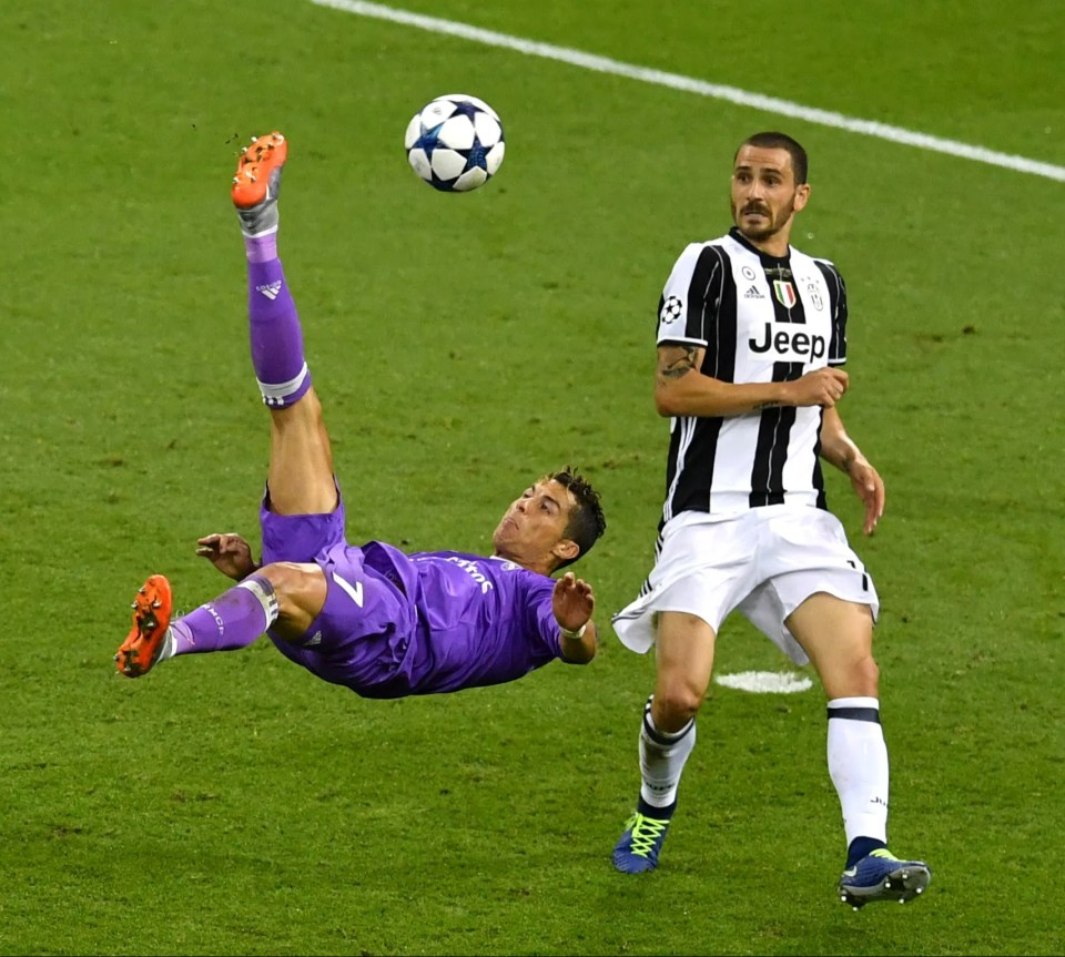 a soccer player wearing a jeep jersey kicks the ball