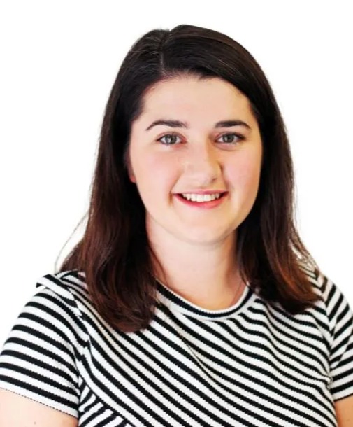 a woman wearing a black and white striped shirt smiles for the camera