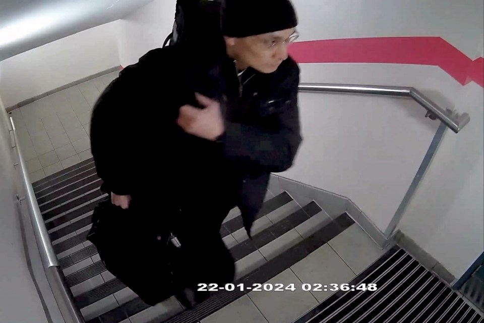 a photo of a man walking down stairs taken on 22-01-2024