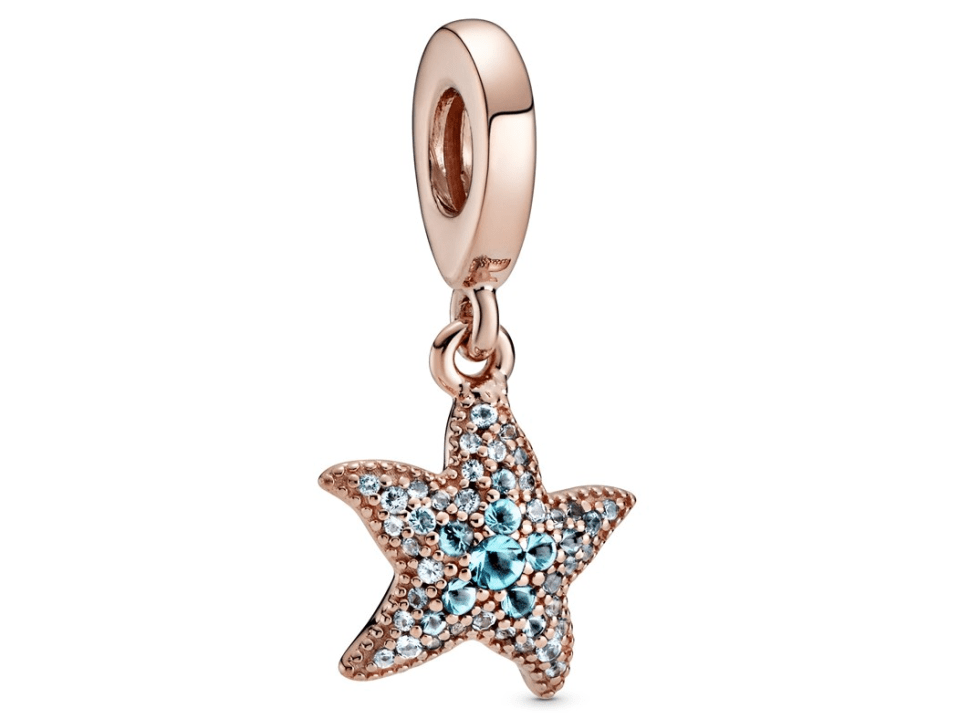 The drop charm features beaded detailing and dazzling blue crystals