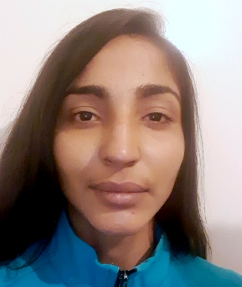 a close up of a woman 's face with long hair .