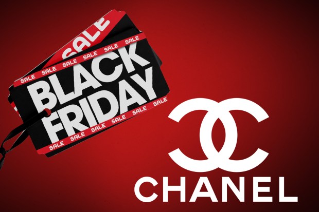 a black friday sale sign next to a chanel logo