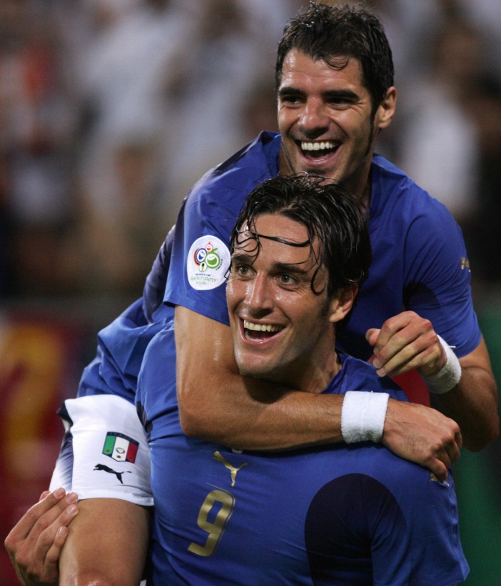 Luca Toni, wearing No9, and Italian midfielder Simone Perrotta after he scored the third goal during the World Cup 2006 quarter final win over Ukraine