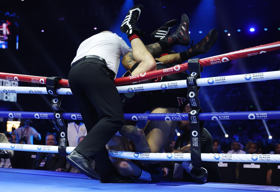 Liam Cameron and Ben Whittaker fall out of the ring during a clinch