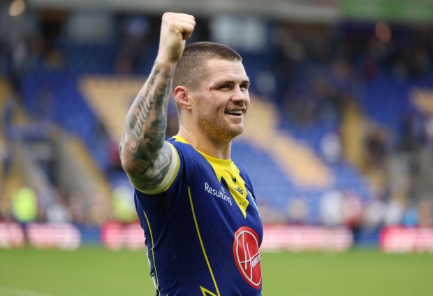 a man in a blue and yellow jersey with the word results on it