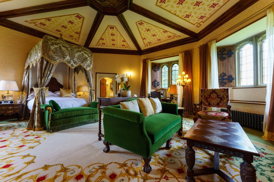 a bedroom with a canopy bed and green furniture