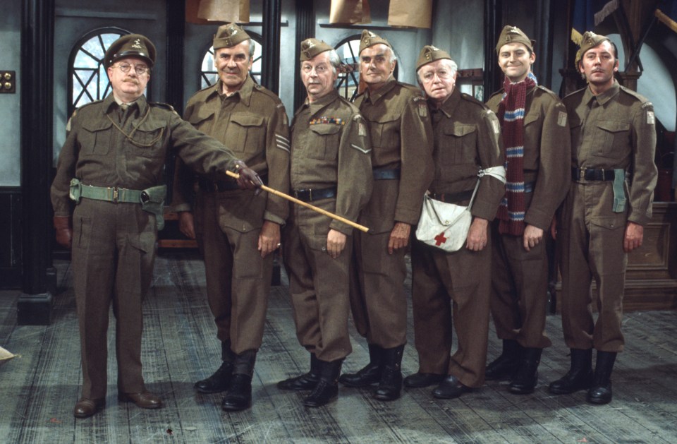 a group of men in military uniforms are posing for a picture