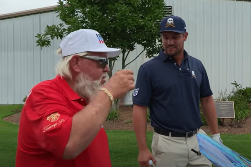 a man with a beard wears a shirt that says tommy hilfiger