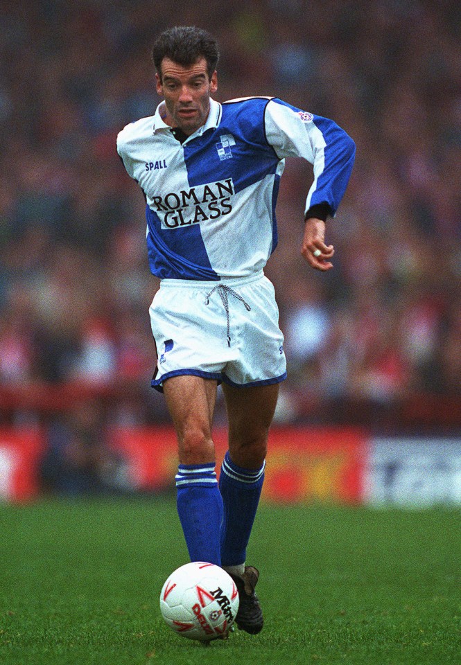 a soccer player with roman glass on his jersey