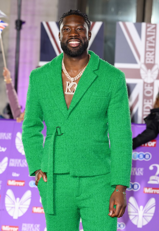 The reality star looked stylish in a green suit on the red carpet at the awards ceremony