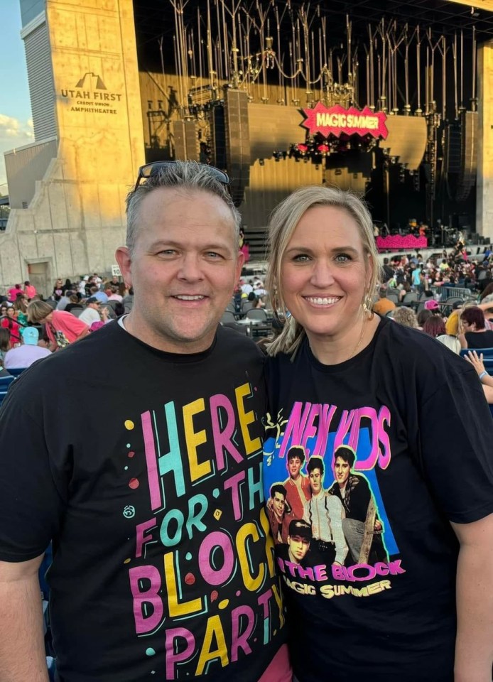 a man and a woman wearing shirts that say here for the block party