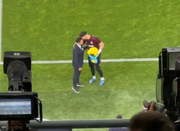 The goalkeeper was presented with flowers by Fenerbahce director Mario Branco