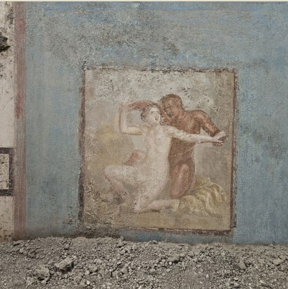 a painting of a man and a woman on a wall