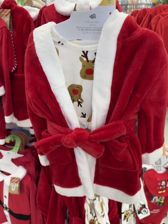 a red and white robe with reindeer on it