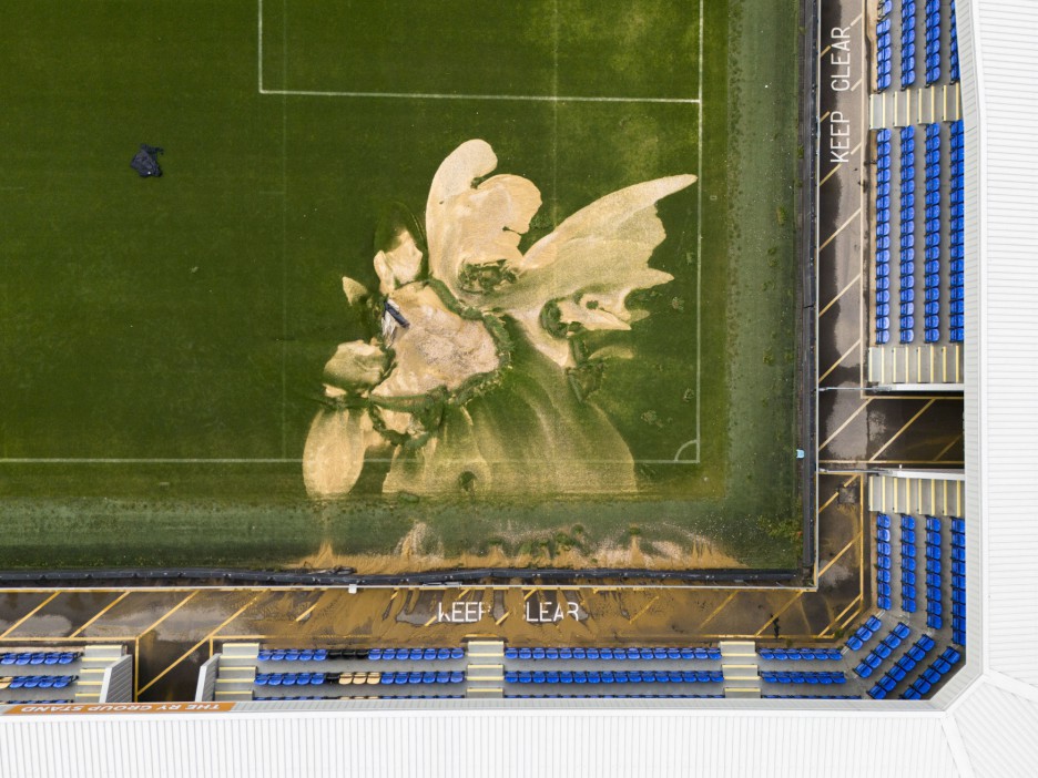 File photo dated 23-09-2024 of A sinkhole on the pitch and flooded walkways at the Cherry Red Records Stadium, home of AFC Wimbledon. AFC Wimbledon's Sky Bet League Two clash with Accrington on Saturday has been postponed after the hosts were unable to secure a viable alternative venue. The sides were scheduled to meet at the Cherry Red Records Stadium, which was hit by flooding on Monday after parts of the country experienced a month's rainfall in 24 hours. Issue date: Wednesday September 25, 2024. PA Photo. See PA story SOCCER Wimbledon. Photo credit should read Jordan Pettitt/PA Wire.