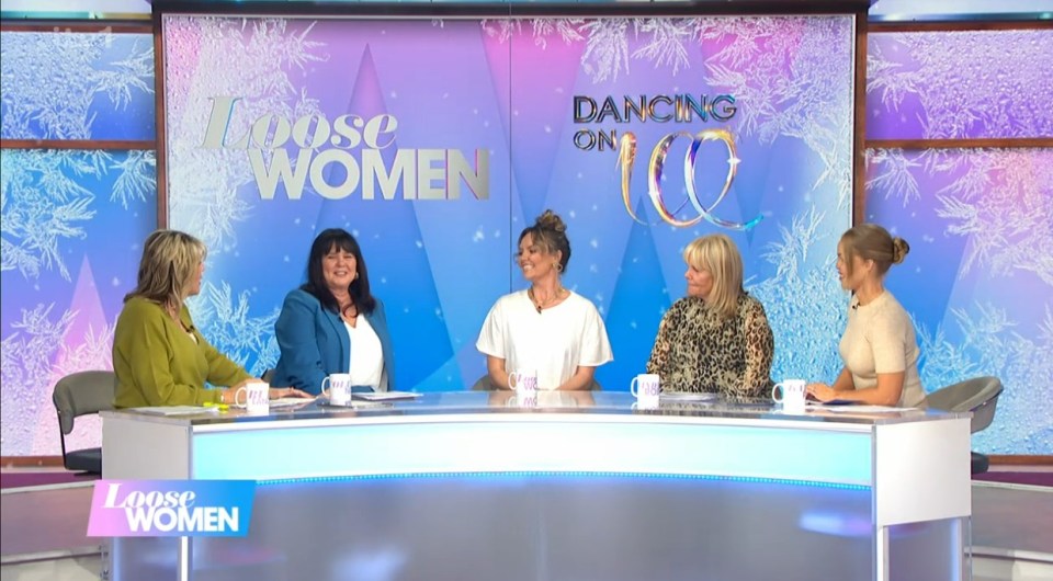 a group of women are sitting at a table on loose women