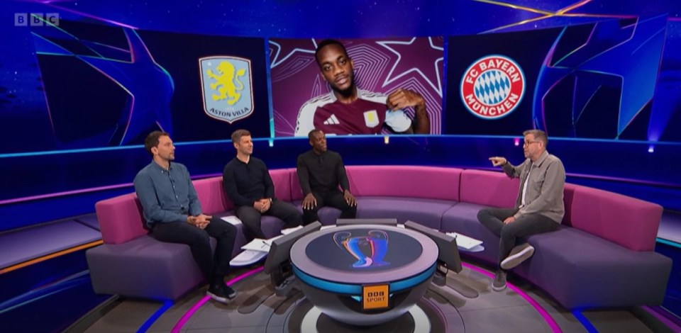 a group of men sit in front of a screen that says bayern munchen