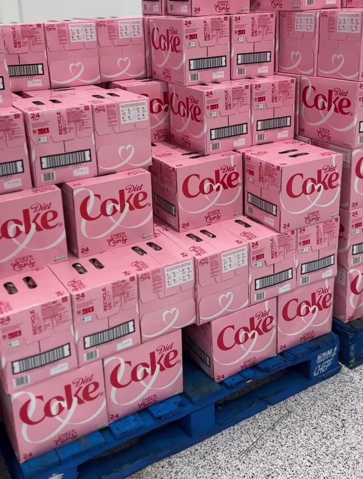 boxes of diet coke are stacked on top of each other