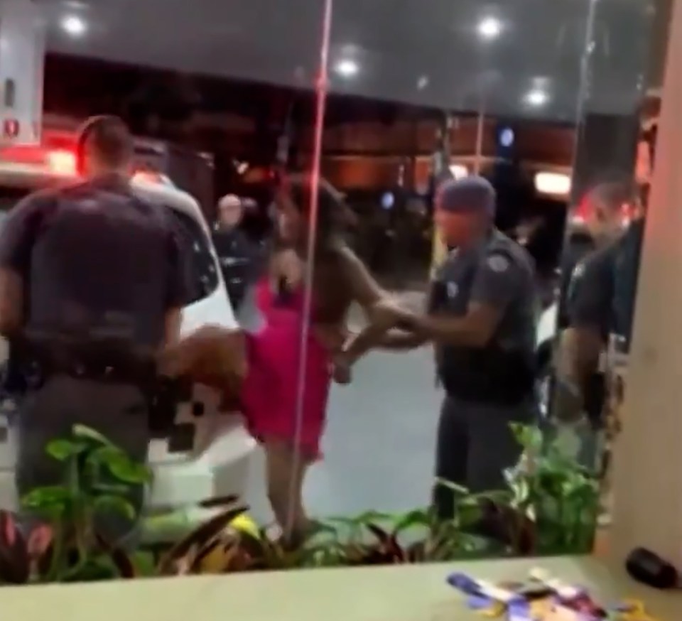 Ana Paula Leme, 47, kicks the police officer in the groin outside a petrol station