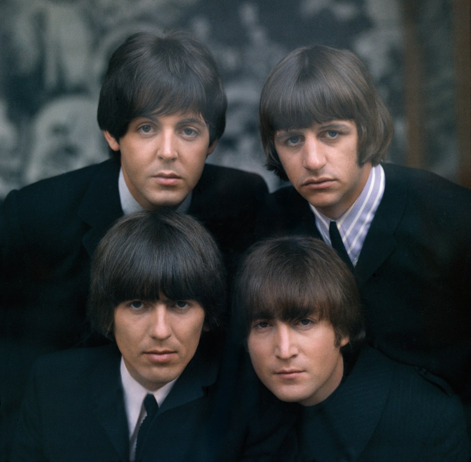 the beatles are posing for a picture together