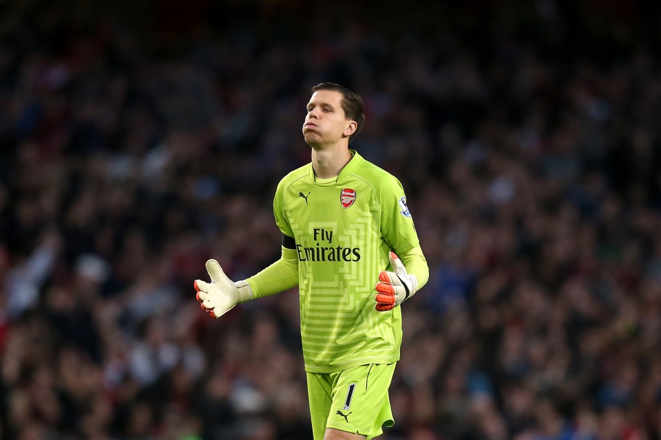 a soccer player wearing a green fly emirates jersey