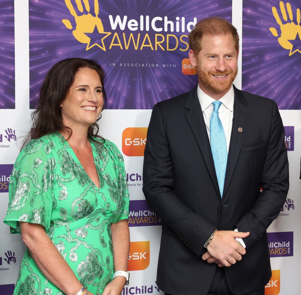 three people stand in front of a wall that says wellchild awards