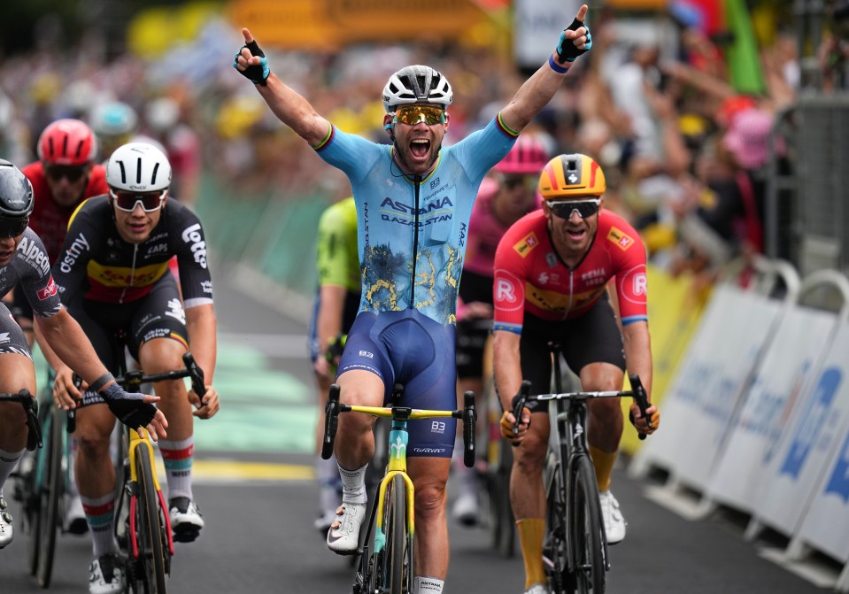 a group of cyclists with one wearing a jersey that says astana