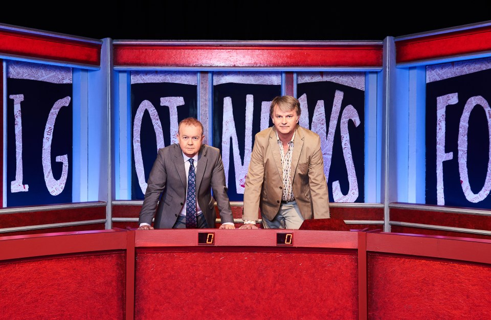 two men standing in front of a sign that says ig of news fo