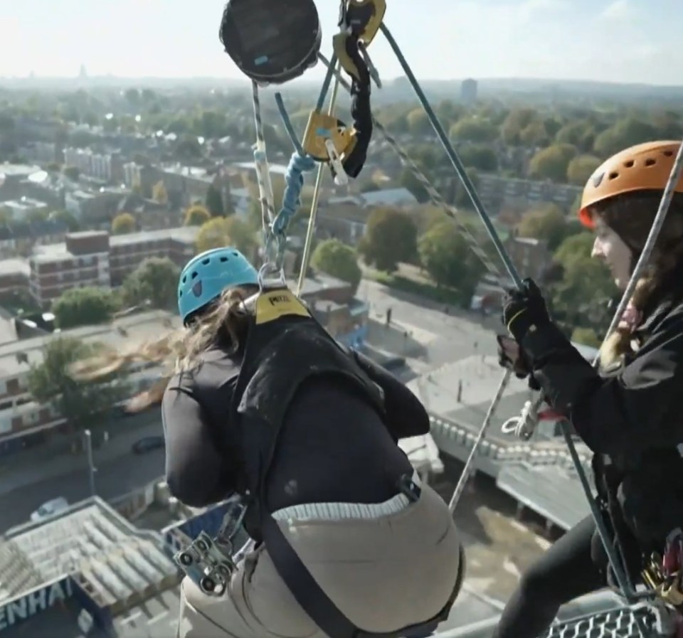 a person wearing a helmet that says petzl on it