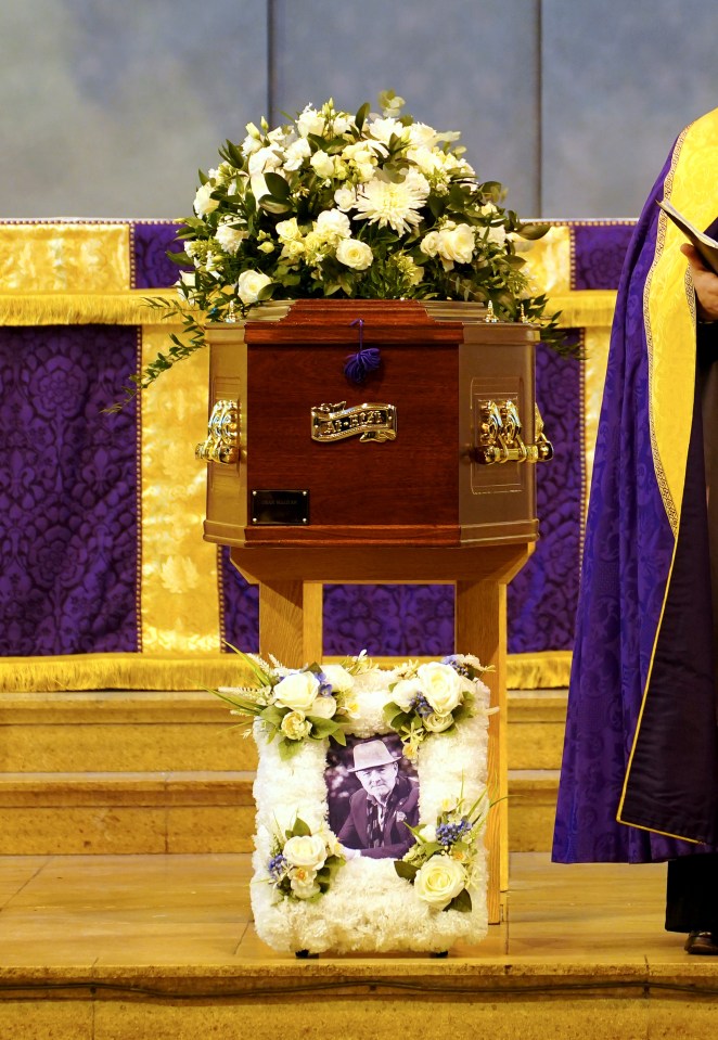 a coffin with a picture of a man on it