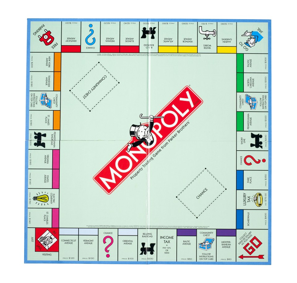 a monopoly board with a red monopoly logo on it