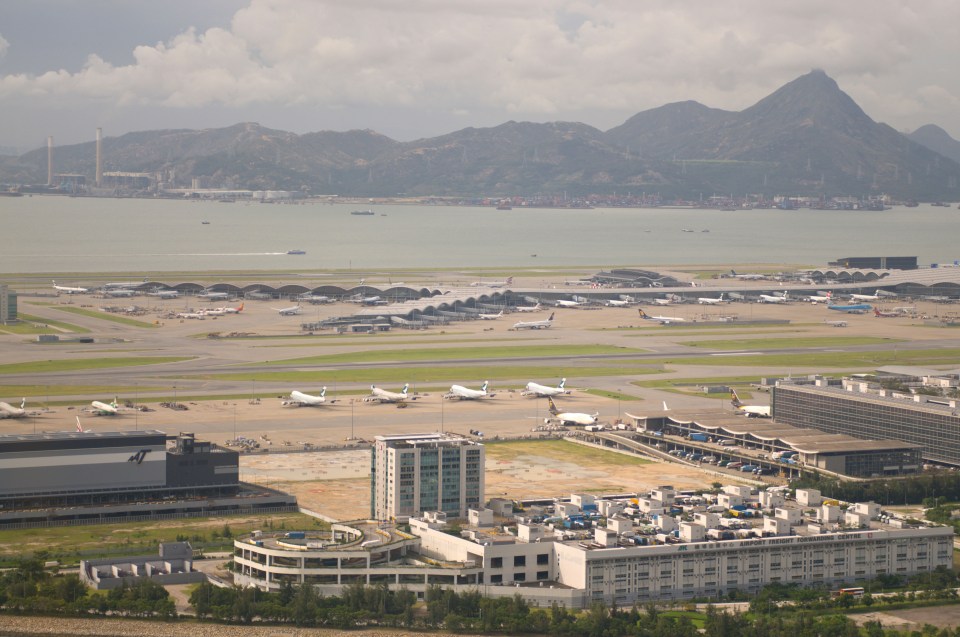 an aerial view of an airport with planes on the runways