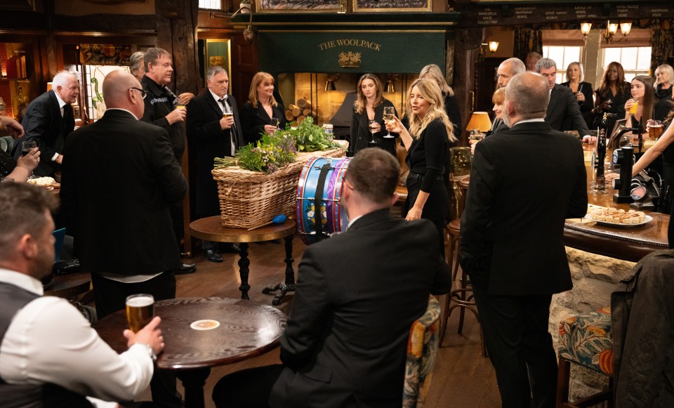 Many of the villagers take it in turns to toast Zak and share memories about him