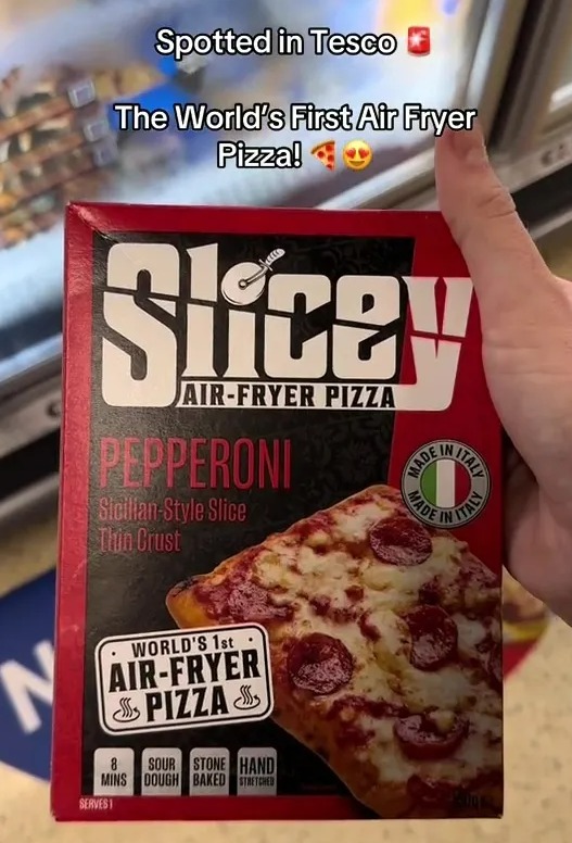 a person is holding a box of pepperoni air fryer pizza