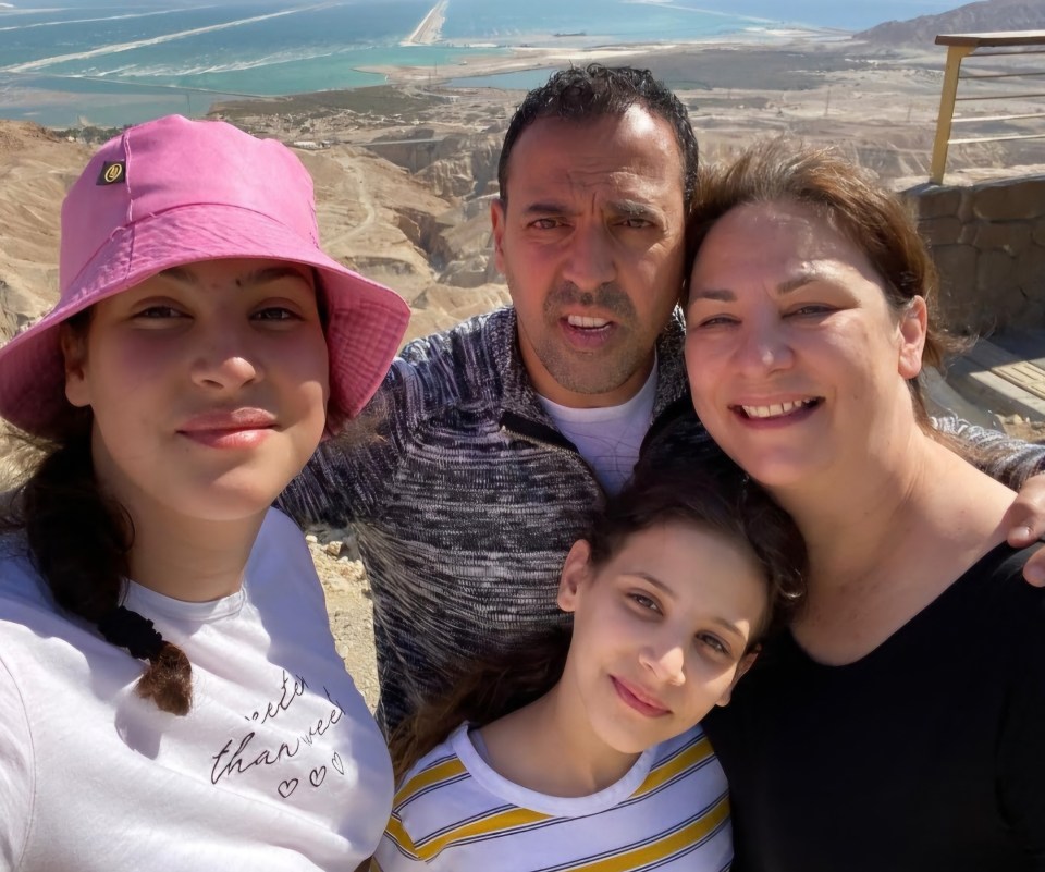 a family posing for a picture with one girl wearing a shirt that says " i 'm a little brave "