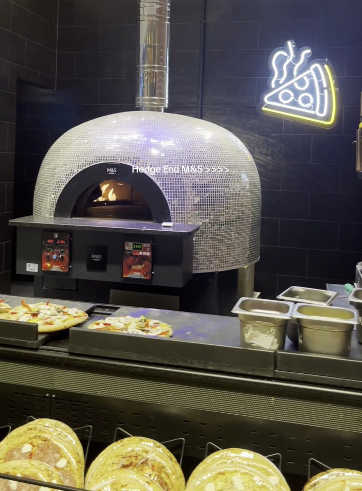 It has a glitterball pizza oven for chefs to cook your dinner fresh in-store