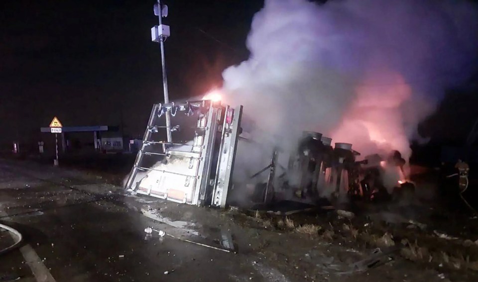 Thick smoke poured into the sky from what was left of the lorry and car