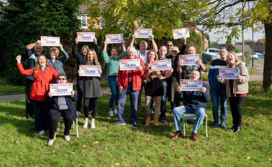 Mark and Tracy celebrated with 17 other neighbours thanks to their postcode of S41 8QT came up in the Postcode Lottery draw