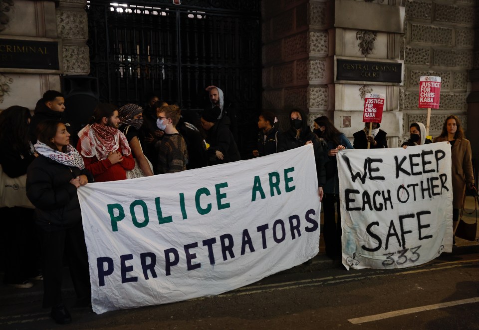 Protestors displayed anti-police banners at the Old Bailey protest