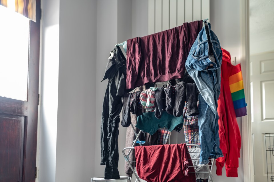 a bunch of clothes are hanging on a clothes line