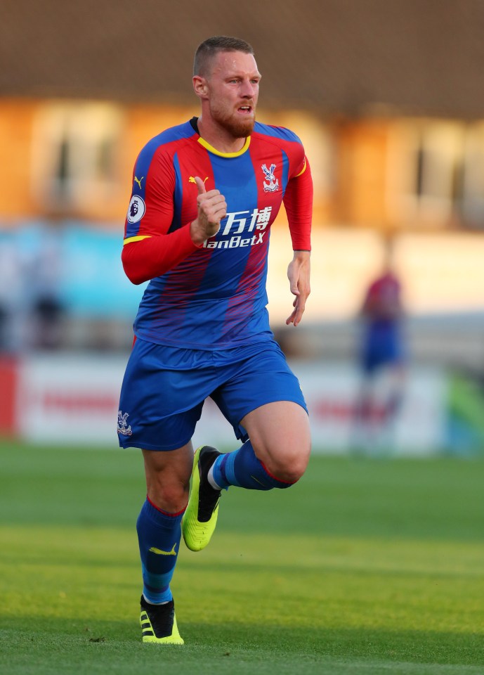 a soccer player wearing a blue and red shirt that says lanbetx