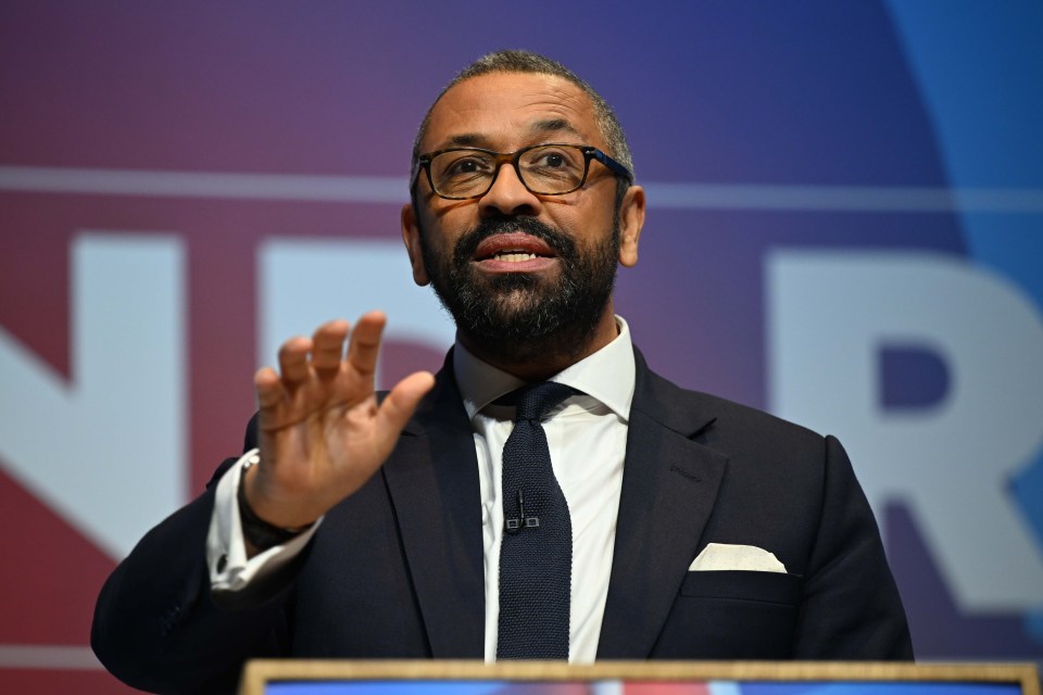 a man in a suit and tie is giving a speech