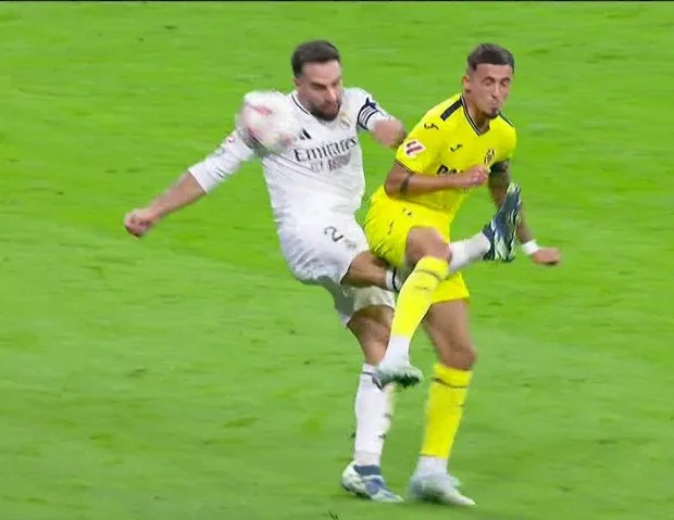 two soccer players are playing a game of soccer on a field .