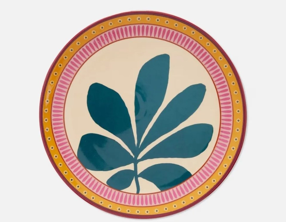 a colorful plate with a blue leaf on it